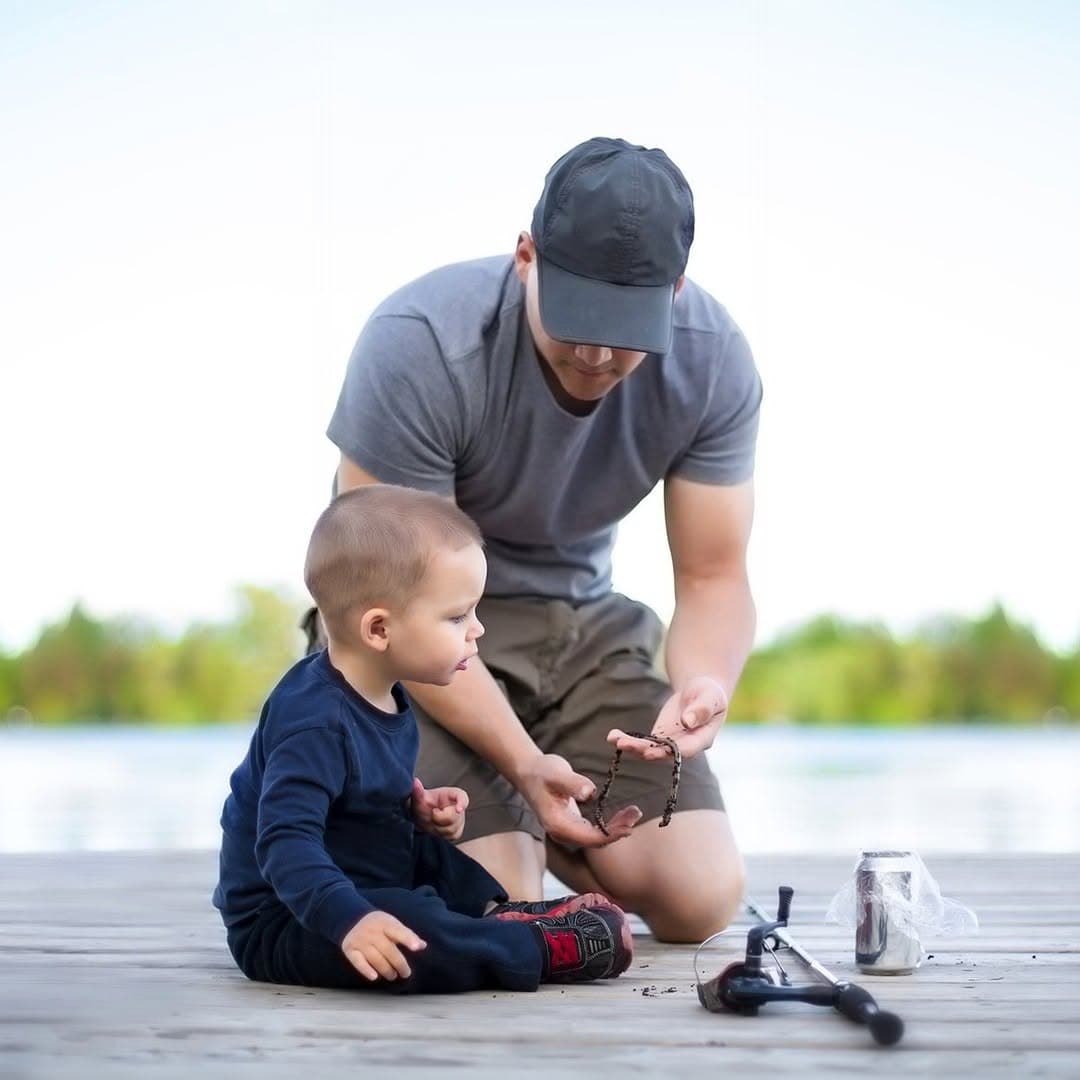 Father and child fishing on the dock at Hall's Cottages, Georgian Bay