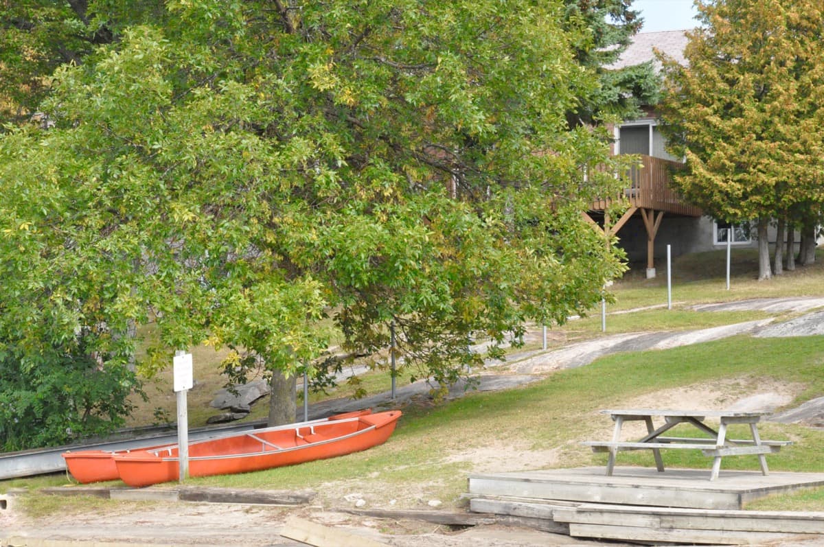 Canoes and picnic area at Hall's Cottages on Georgian Bay, Honey Harbour Ontario