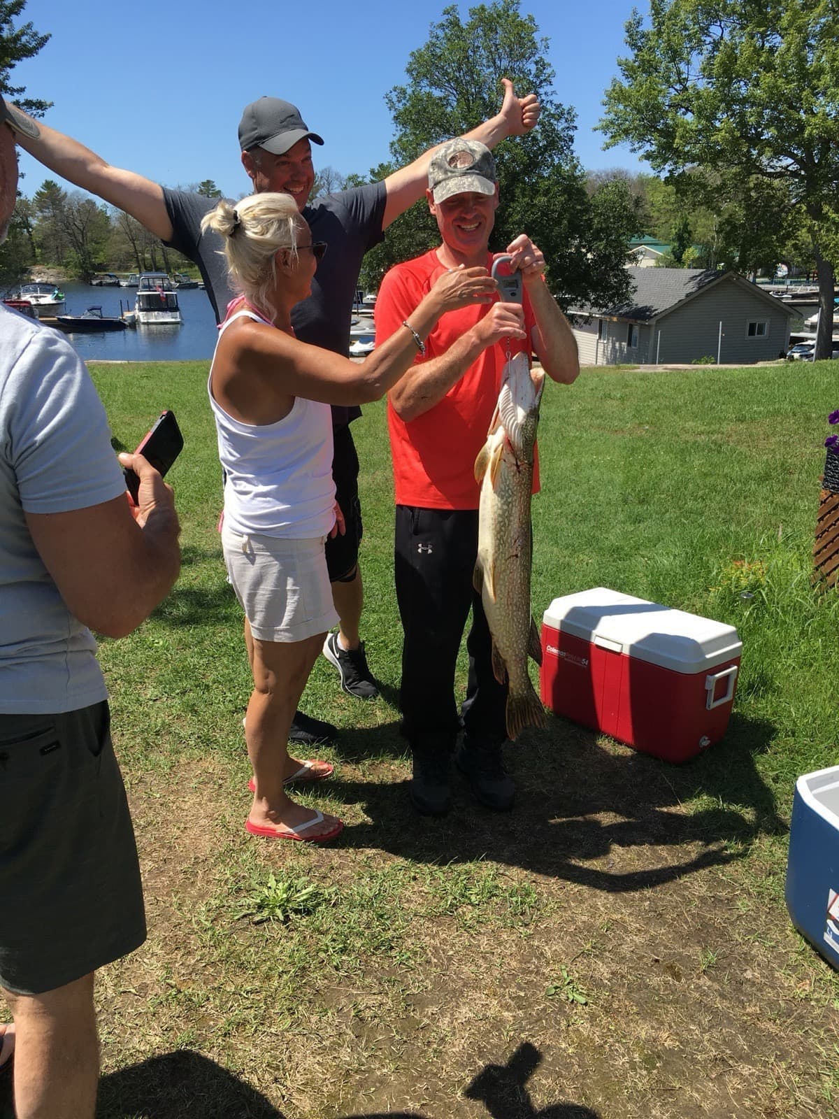 Guests with Northern Pike catch at Hall's Cottages, Honey Harbour